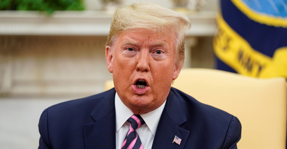 U.S. President Donald Trump speaks during a meeting with U.S. Representative Jeff Van Drew, a Democratic lawmaker who opposed his party's move to impeach Trump, after Van Drew announced he was becoming a Republican, in the Oval Office of the White House in Washington, U.S.، December 19, 2019. REUTERS/Joshua Roberts - RC2LYD9TMVVC