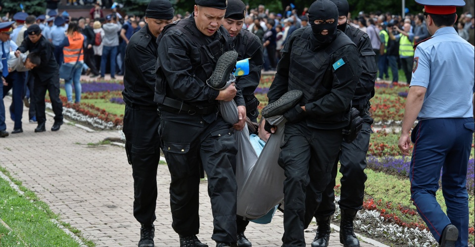 Police officers detain an opposition supporter during a protest against presidential election, in Almaty, Kazakhstan, June 9, 2019.  REUTERS/Mariya Gordeyeva