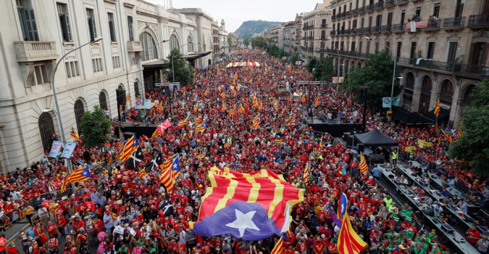 People hold up Esteladas (Catalan separatist flag) during the National Day Catalonia, called 'La Diada', in Barcelona, Spain, September 11, 2021. REUTERS/Albert Gea