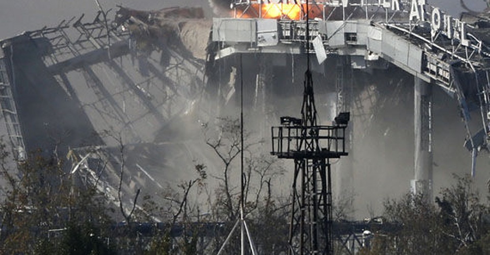 The main terminal of Donetsk Sergey Prokofiev International Airport hit by shelling during fighting between pro-Russian rebels and Ukrainian government forces in the town of Donetsk, eastern Ukraine, Wednesday, Oct. 8, 2014. (AP Photo/Dmitry Lovetsky)